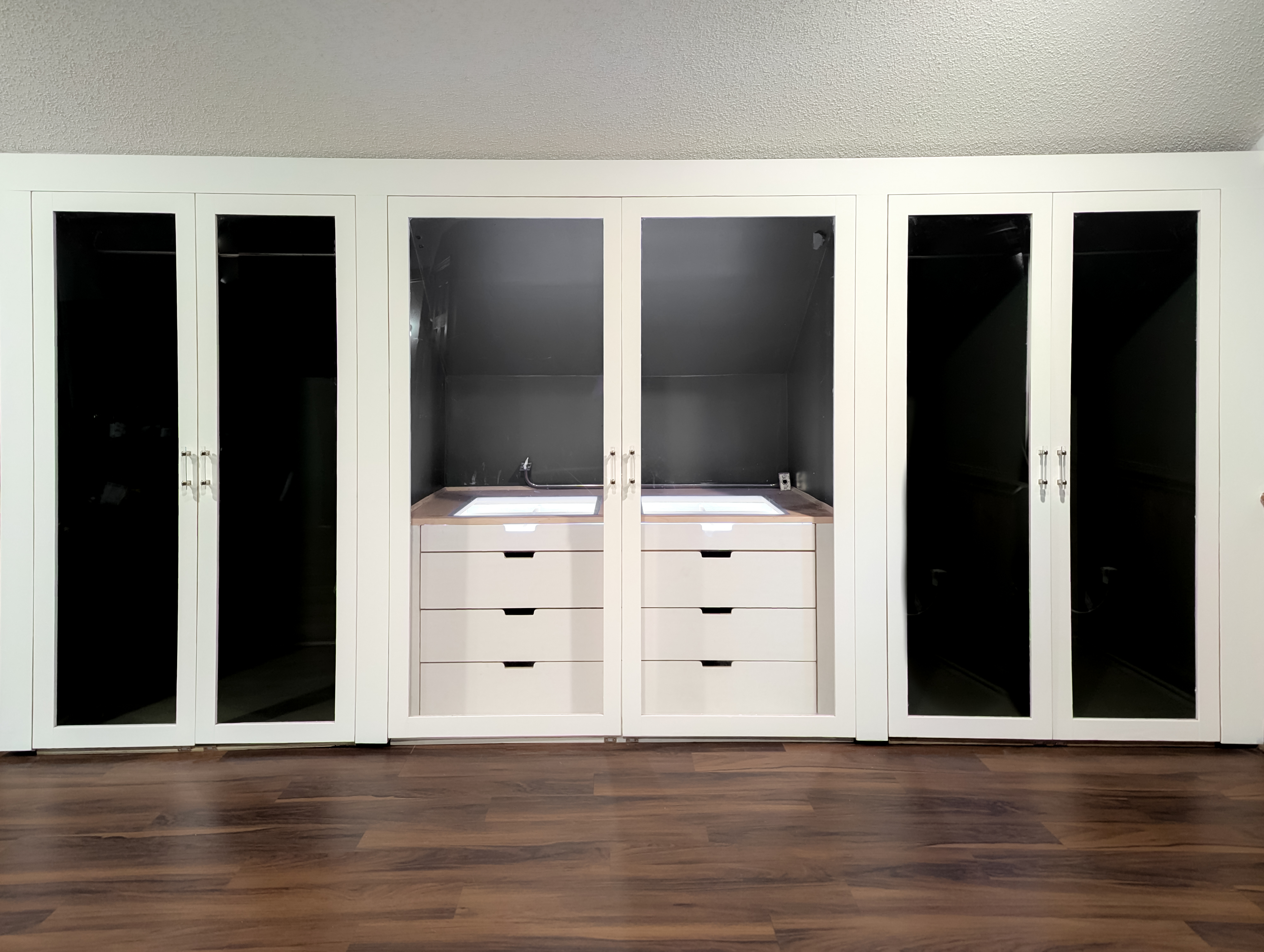 Upper suite built-in glass-front closet