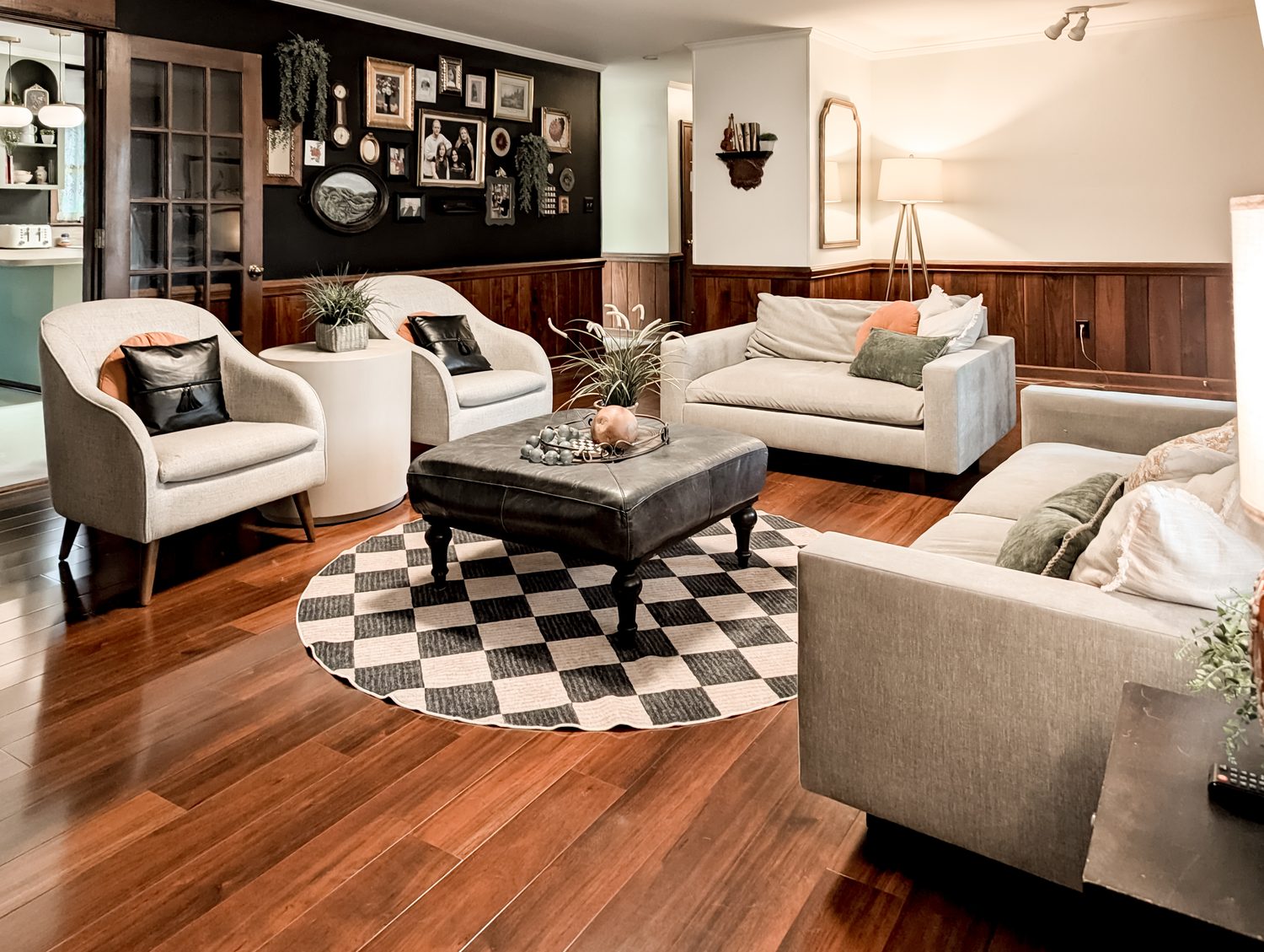 Living room with checkerboard rug and gallery wall